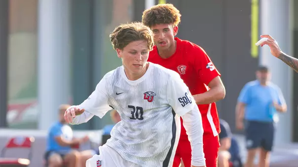 Men's Soccer - Ronnie Gorman passes a Radford Player 8-12-26