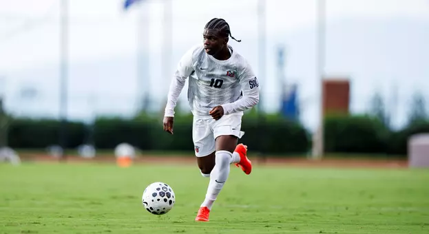 Men's Soccer - Samson Kpardeh moves up field vs. FGCU