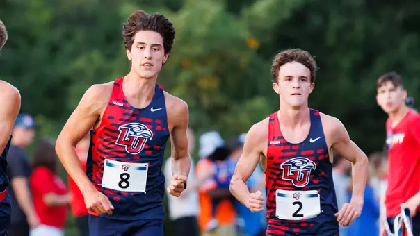 Andrew Schultz and Eli Julian compete in the Liberty Challenge cross country meet on Aug. 29, 2005.