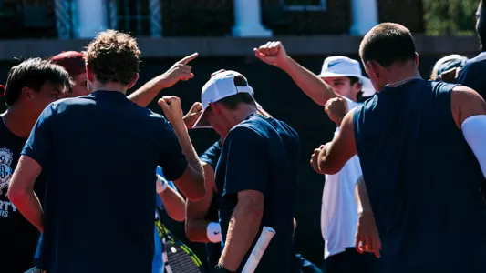 Men's Tennis Team Huddle at a practice