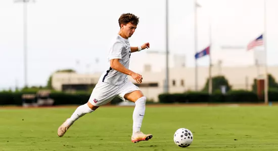 Men's Soccer - Ronnie Gorman kicks the ball forward