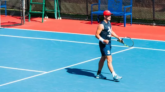 Men's Tennis Nate Pitts after a point in practice