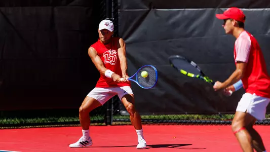 Men's Tennis, Robinson and Pitts in a Doubles Point at the Liberty Tennis Complex