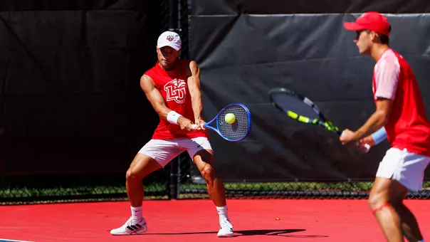 Men's Tennis, Robinson and Pitts in a Doubles Point at the Liberty Tennis Complex