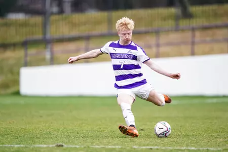Men's Soccer Player Shooting