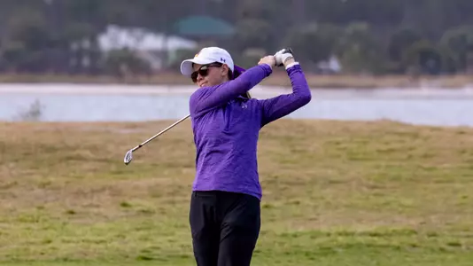 Womens golfer swinging