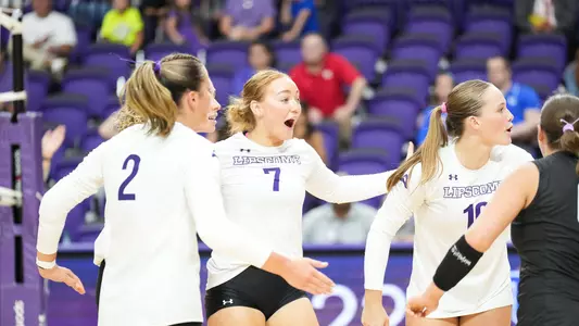Anna Claire Brown, volleyball team huddle after a point