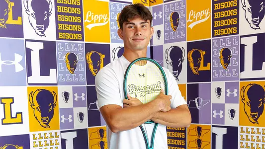 Matei Daniel Stan with a tennis racquet