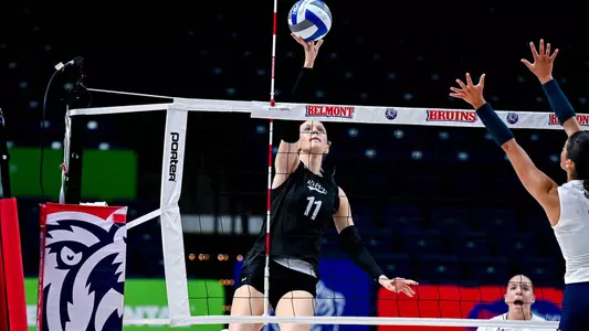 Brooklyn Fuchs attacking a ball at the net.