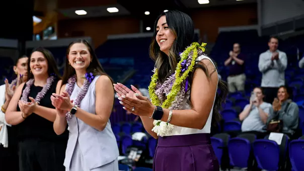 Sarah Baldwin honored with leis prior to first match as head coach.
