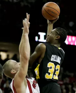 Stephan Gilling shoots over Wisconsin's Joe Krabbenhoft during the first half.