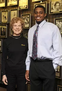 Marilyn Bohl recently pictured with men's basketball redshirt Stephan Gilling.