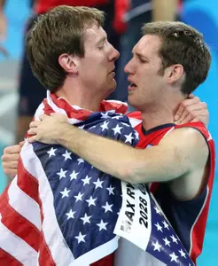 Scott Touzinsky (right) celebrates after winning Gold in Beijing.