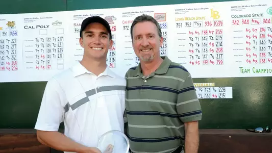 Senior Michael Drake celebrates with his father as he won the individual medalist at the 14th Annual Del Walker Intercollegiate Golf Classic.