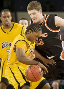 Pacific center Casey Neimeyer, right, stops Cal State Long Beach guard Casper Ware in the first half. (AP Photo/Mark Avery)