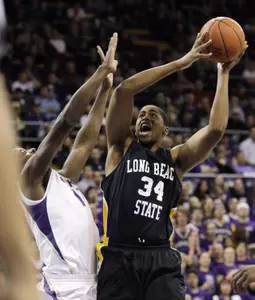 Long Beach State's Kyle Richardson (34) shoots past the defense of Washington's Matthew Bryan-Amaning in the first half of an NCAA college basketball game Tuesday, Nov. 30, 2010, in Seattle. (AP Photo/Elaine Thompson)