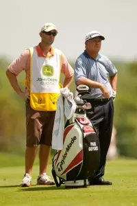 Former 49er golfer Paul Goydos (right) stands next to his caddie Chris Mazziotti at the John Deere Classic in Silvis, Ill. (Photo by Darren Carroll/Getty Images)