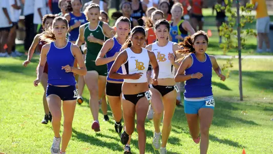 Liz Ramos and Alisia Barajas paced the 49ers to a second place finish at the Fullerton Season Opener.  (Photo by Stephen Carr/LBSU)