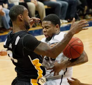 Pittsburgh's Nasir Robinson, right, loses control of the ball as he is defended by Long Beach State's T.J. Robinson. (AP Photo/Keith Srakocic)