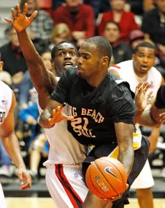 Long Beach St. guard Larry Anderson drive against San Diego St.'s Deshawn Stephens during the second half of San Diego State's 77-73 overtime victory in a NCAA college basketball game  Saturday, Nov. 19, 2011 in San Diego. (AP Photo/Lenny Ignelzi)