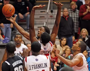 Long Beach St.'s Casper Ware sails past the San Diego St. defense to score in the second half of San Diego's 77-73 overtime victory in a  NCAA college basketball game  Saturday, Nov. 19, 2011 in San Diego. (AP Photo/Lenny Ignelzi)