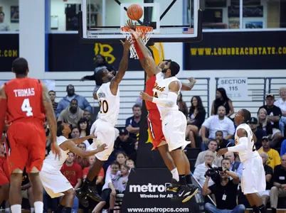 T.J. Robinson (left) became LBSU's all-time leading rebounder on Tuesday