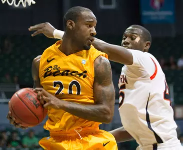 Long Beach State forward T.J. Robinson (20) grabs a rebound away from Auburn forward Adrian Forbes (45) in the first half of an NCAA college basketball game Friday, Dec. 23, 2011, in Honolulu.  (AP Photo/Eugene Tanner)
