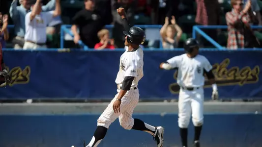 Matt Hibbert crosses the plate in the 10th inning to give the Dirtbags the win.