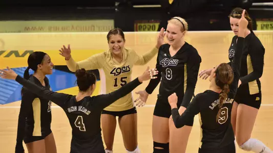 8/20/11 - The Long Beach State Women's Volleyball team celebrate their victory over UMBC during the Long Beach State Mizuno Invitational at the Pyramid. Players include Lauren Minkel (15) and Haleigh Hampton (8).
Long Beach beat UMBC 3-0.
Photos by Steven Georges/Long Beach State