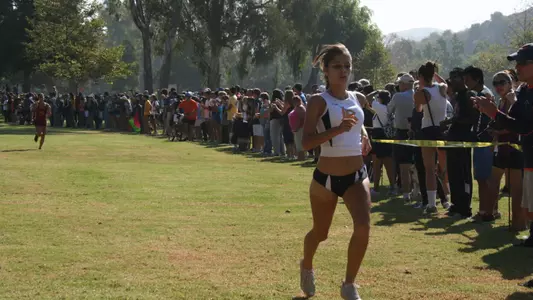 Senior Rosa Del Toro crosses the finish line in first-place at the Asics Season Opener in Brea.