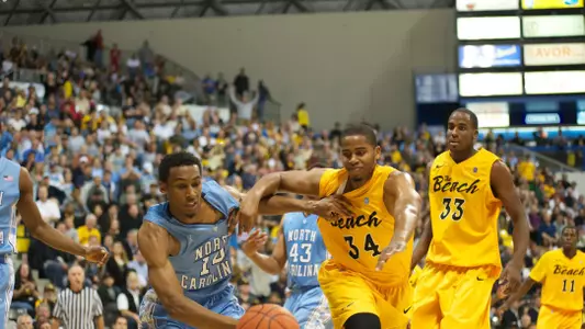 Kyle Richardson and Desmond Hubert battle for a loose ball as LBSU took on North Carolina on Friday, Nov. 16.
