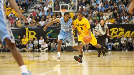 Mike Caffey drives past Dexter Strickland of North Carolina on Friday, Nov. 16.