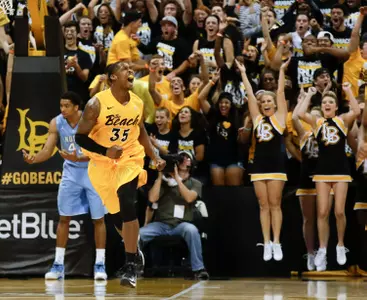 Long Beach State's Dan Jennings (35) celebrates a basket as North Carolina's James Michael McAdoo looks away during  the first half of an NCAA college basketball game in Long Beach, Calif. Friday, Nov. 16, 2012. (AP Photo/Chris Carlson)