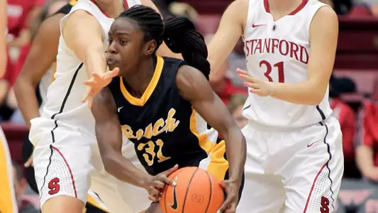 Long Beach State guard Chantel Dooley (31) moves the ball around as Stanford forward Mikaela Ruef (3) and guard Toni Kokenis (31) defend during the first half of an NCAA college basketball game in Stanford, Calif., Sunday, Nov. 25, 2012. (AP Photo/Tony Avelar)