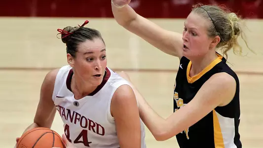Stanford forward Joslyn Tinkle (44) looks to pass the ball against Long Beach State forward Ella Clark during the second half of an NCAA college basketball game in Stanford, Calif., Sunday, Nov. 25, 2012. Stanford won 77-41. (AP Photo/Tony Avelar)