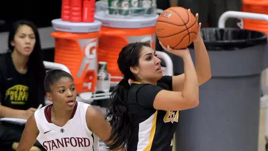 Long Beach State guard Alex Sanchez. right, shoots as Stanford guard Amber Orrange (33) defends during the second half of an NCAA college basketball game in Stanford, Calif., Sunday, Nov. 25, 2012. Stanford won 77-41. (AP Photo/Tony Avelar)