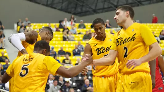 The 49ers help up Mike Caffey in the non-conference match against BYU-Hawaii at the Walter Pyramid, Long Beach, Calif., Sat., Dec. 15, 2012.
