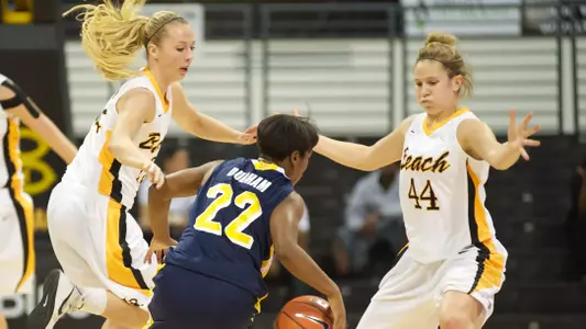 Ella Clark and Laura Spargo in the Beach Classic game against Canisius at the Walter Pyramid, Long Beach, Calif., Thu., Dec. 20, 2012.