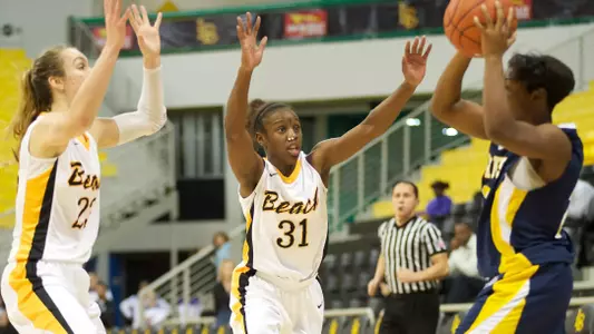 Mary Ochiltree and Chantel Dooley in the Beach Classic game against Canisius at the Walter Pyramid, Long Beach, Calif., Thu., Dec. 20, 2012.