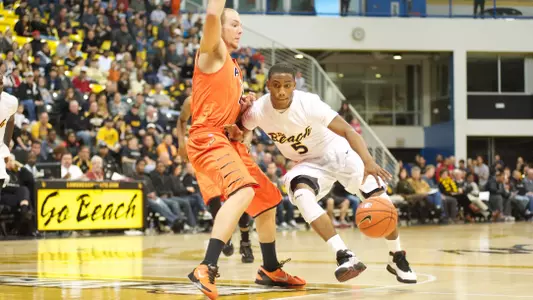 Mike Caffey drives towards the basket against Pacific Saturday afternoon at the Water Pyramid.
