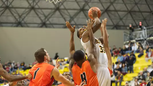 Dan Jennings gets fouled going in for a layup against Pacific Saturday afternoon at the Water Pyramid.