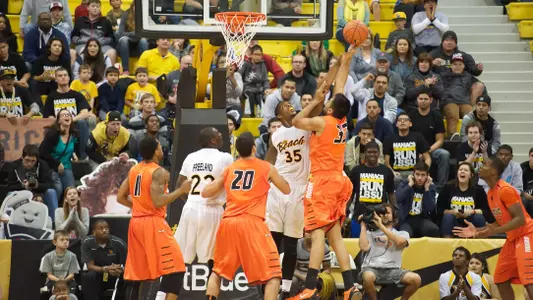 Dan Jennings blocks a shot during the game against Pacific Saturday afternoon at the Water Pyramid.