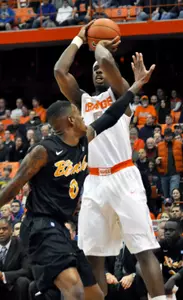 Syracuse's C. J. Fair, right, shoots over Long Beach State's Kris Gulley. (AP Photo/Kevin Rivoli)