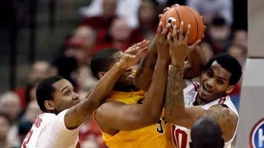 Ohio State's LaQuinton Ross, right, and Amir Williams, left, work for a rebound against Long Beach State's Kyle Richardson as Ohio State's Shannon Scott looks on during the first half of an NCAA college basketball game in Columbus, Ohio, Saturday, Dec. 8, 2012. Ohio State won 89-55. (AP Photo/Paul Vernon)