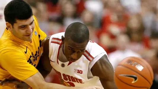 Ohio State's Shannon Scott, right, knocks the ball away from Long Beach State's Peter Pappageorge during the second half of an NCAA college basketball game in Columbus, Ohio, Saturday, Dec. 8, 2012. Ohio State won 89-55. (AP Photo/Paul Vernon)