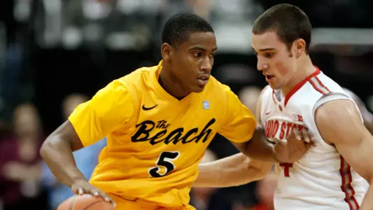 Long Beach State's Mike Caffey, left, tries to get around Ohio State's Aaron Craft during the first half of an NCAA college basketball game in Columbus, Ohio, Saturday, Dec. 8, 2012. (AP Photo/Paul Vernon)