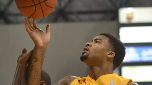 2/25/12 - Eugene Phelps (4) of the Long Beach State Basketball team.
Photo by Steven Georges/LBSU