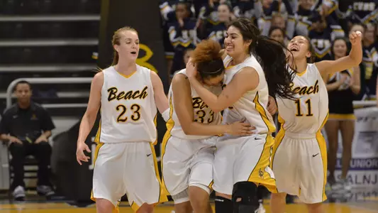 3/1/12 - Mary Ochiltree (23) Tipesa Moorer (33) Alex Sanchez (3) Hallie Meneses (11) of the Long Beach State Women's Basketball team celebrate after defeating Fullerton 61-62 in their last regular season home game at the Pyramid
Photo by Steven Georges/LBSU
LBSU Photo Archive
     www.StevenGeorges.com/LBSU