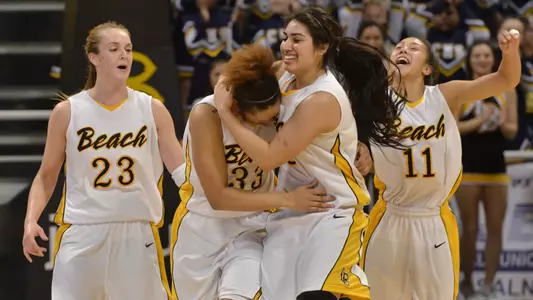 3/1/12 - Mary Ochiltree (23) Tipesa Moorer (33) Alex Sanchez (3) Hallie Meneses (11) of the Long Beach State Women's Basketball team celebrate after defeating Fullerton 61-62 in their last regular season home game at the Pyramid
Photo by Steven Georges/LBSU
LBSU Photo Archive
     www.StevenGeorges.com/LBSU
