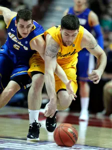 UC Santa Barbara forward Keegan Hornbuckle, left, battles for the ball with Long Beach State forward Edis Dervisevic (13) during the first half of an NCAA college basketball game in the championship of their Big West Conference tournament, Saturday, March 10, 2012, in Anaheim, Calif. (AP Photo/Alex Gallardo)